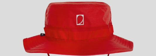 Martha Headwear logo on red hat