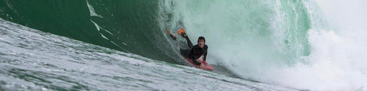 man body board surfing wearing chuchill makapuu pro fins