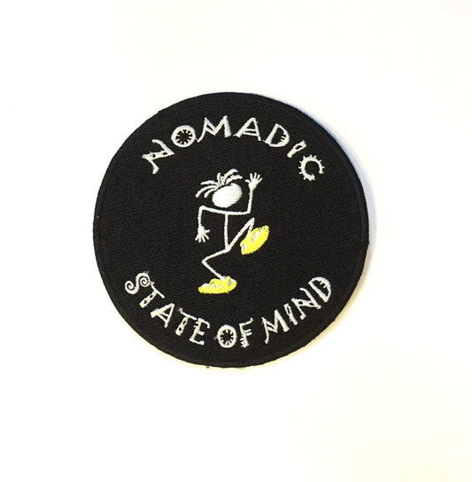 nomadic state of mind logo on black background